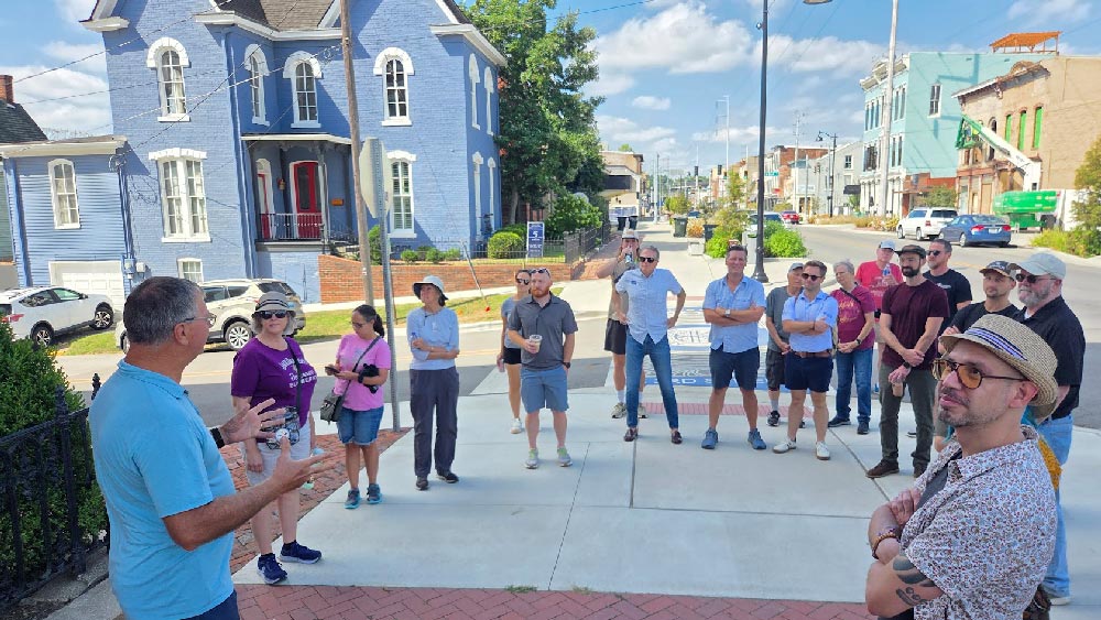 Jerry Finn talking with the group in front of Town Clock Church