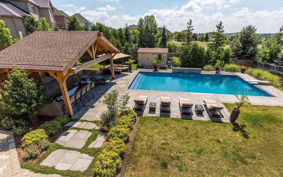 An aerial view of a modern pool and cabana Conestoga.