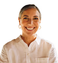 A woman smiling confidently, exuding positivity and self-assurance.