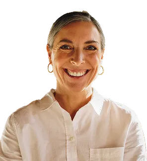 A woman smiling confidently, exuding positivity and self-assurance.