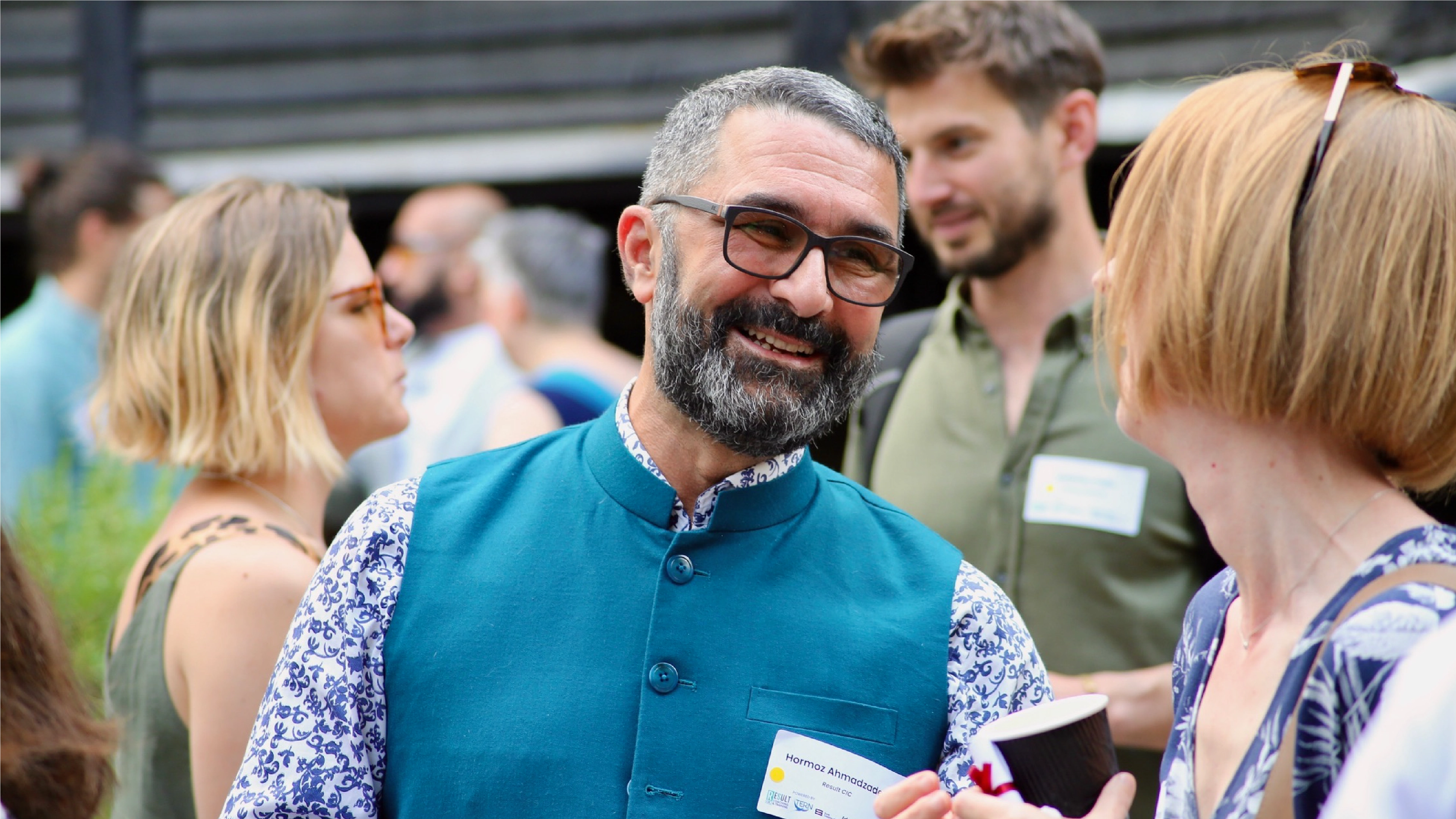 A photograph of people attending the Result CIC event, community engagement, helping minorities.