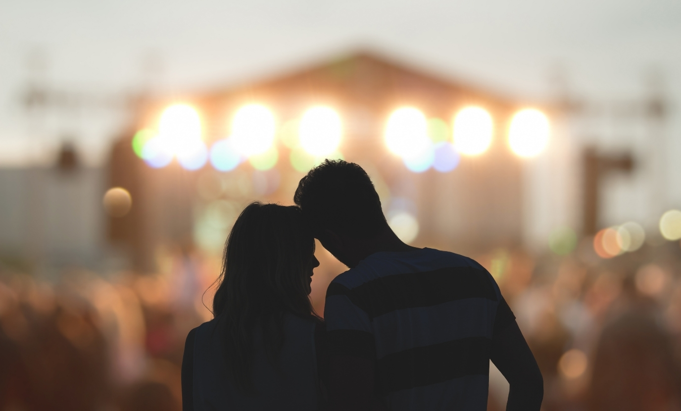 Young couple at concert.