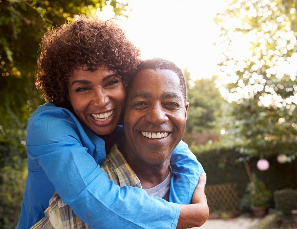 Mature couple smiling.