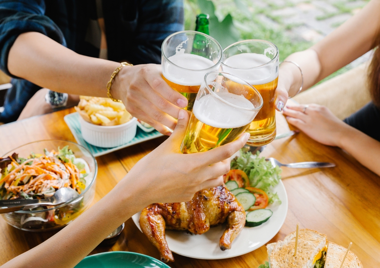 Friends cheers beer.