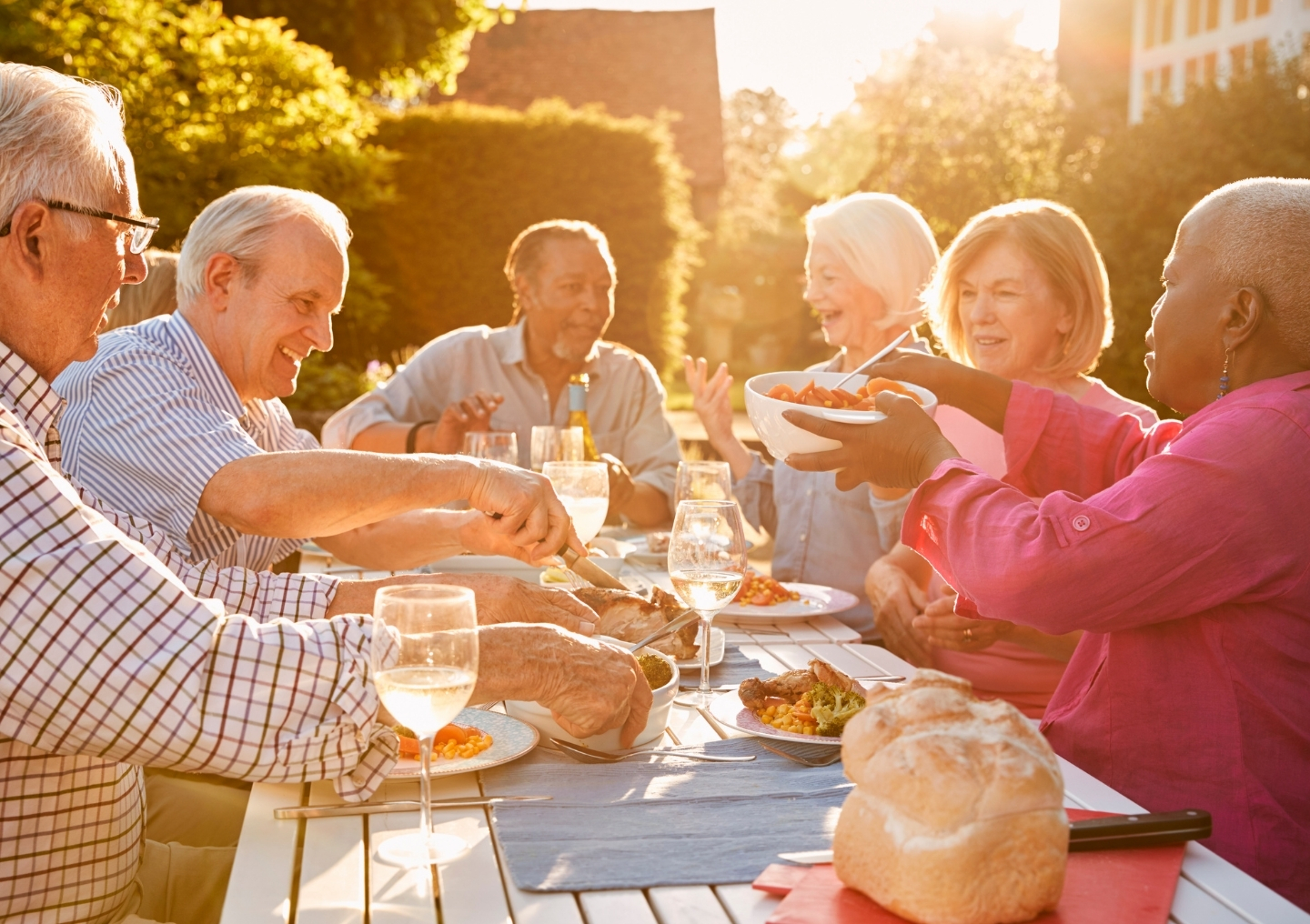 Senior friends eating together.