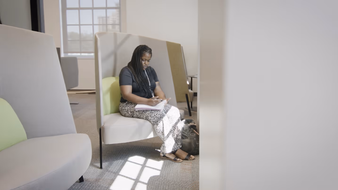 Nurse working on laptop during NNCC commercial filmed by Camos Media.