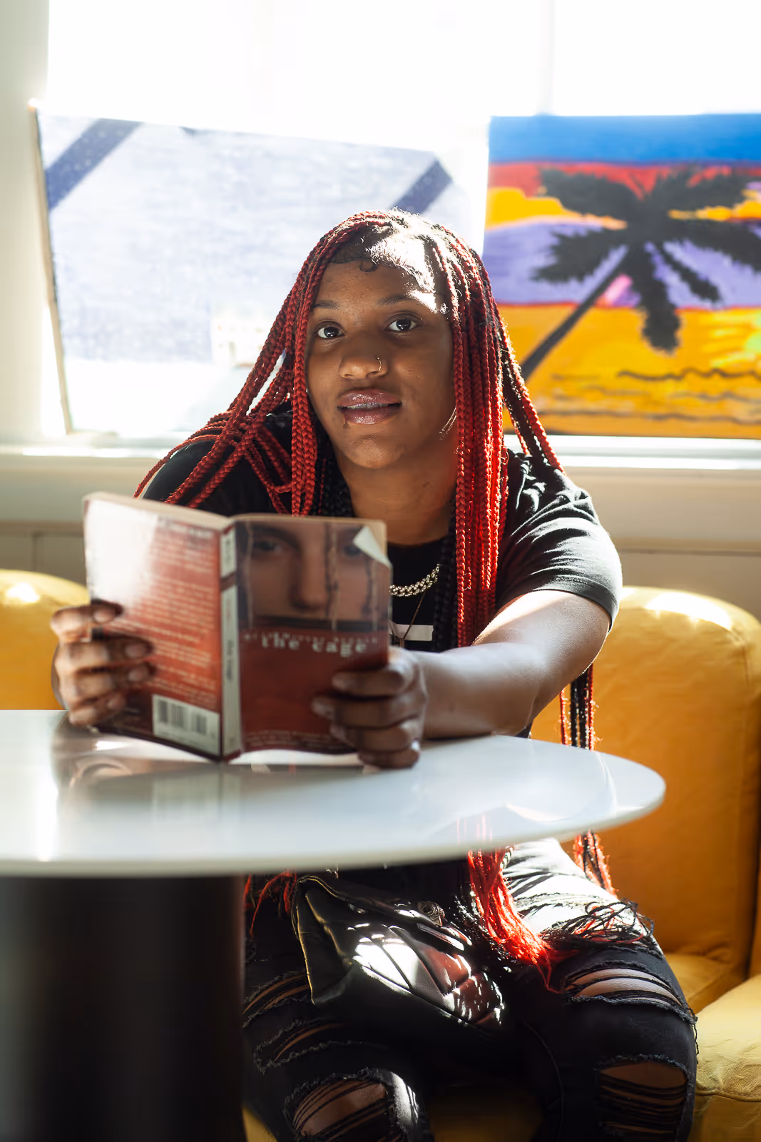 Student reading a book featured in Mill Creek School video filmed by Camos Media.