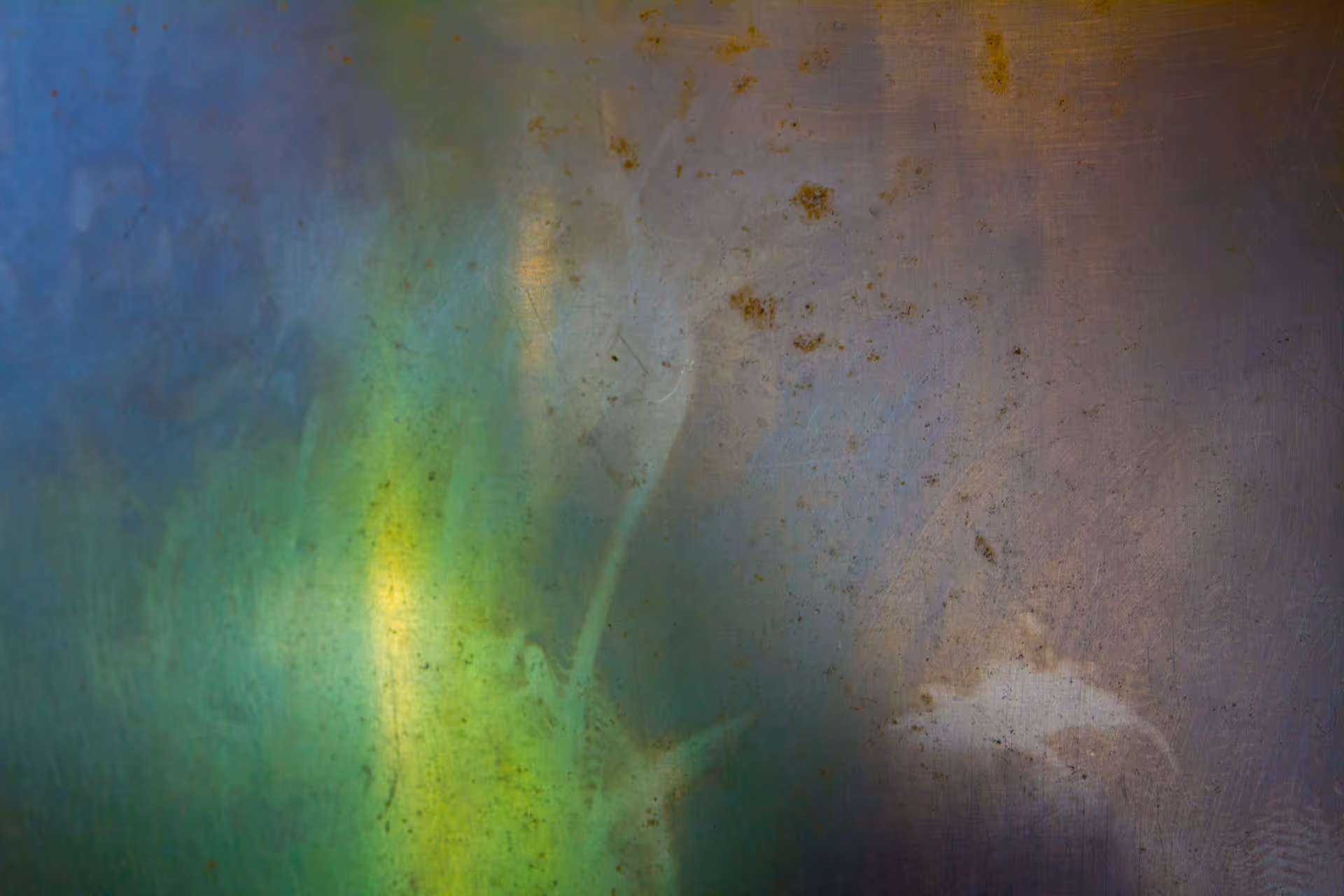 Colorful abstract creative photo with green, blue, and purple hues captured by Camos Media.