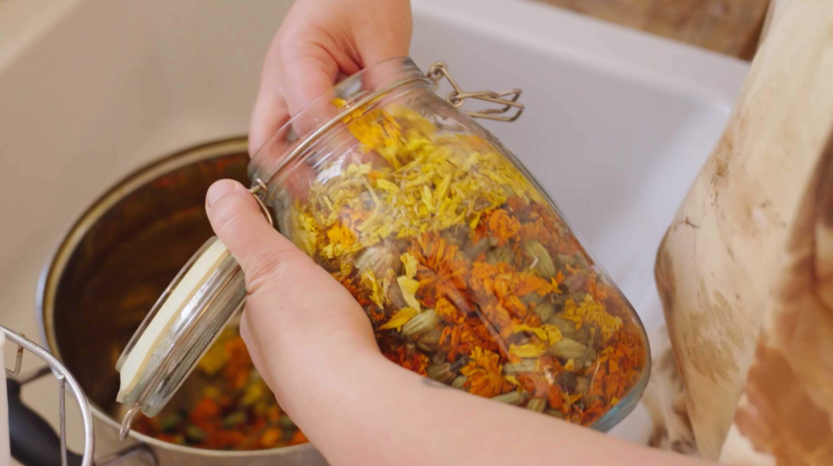 Hand selecting flower petals for a natural dye project with Fibershed.