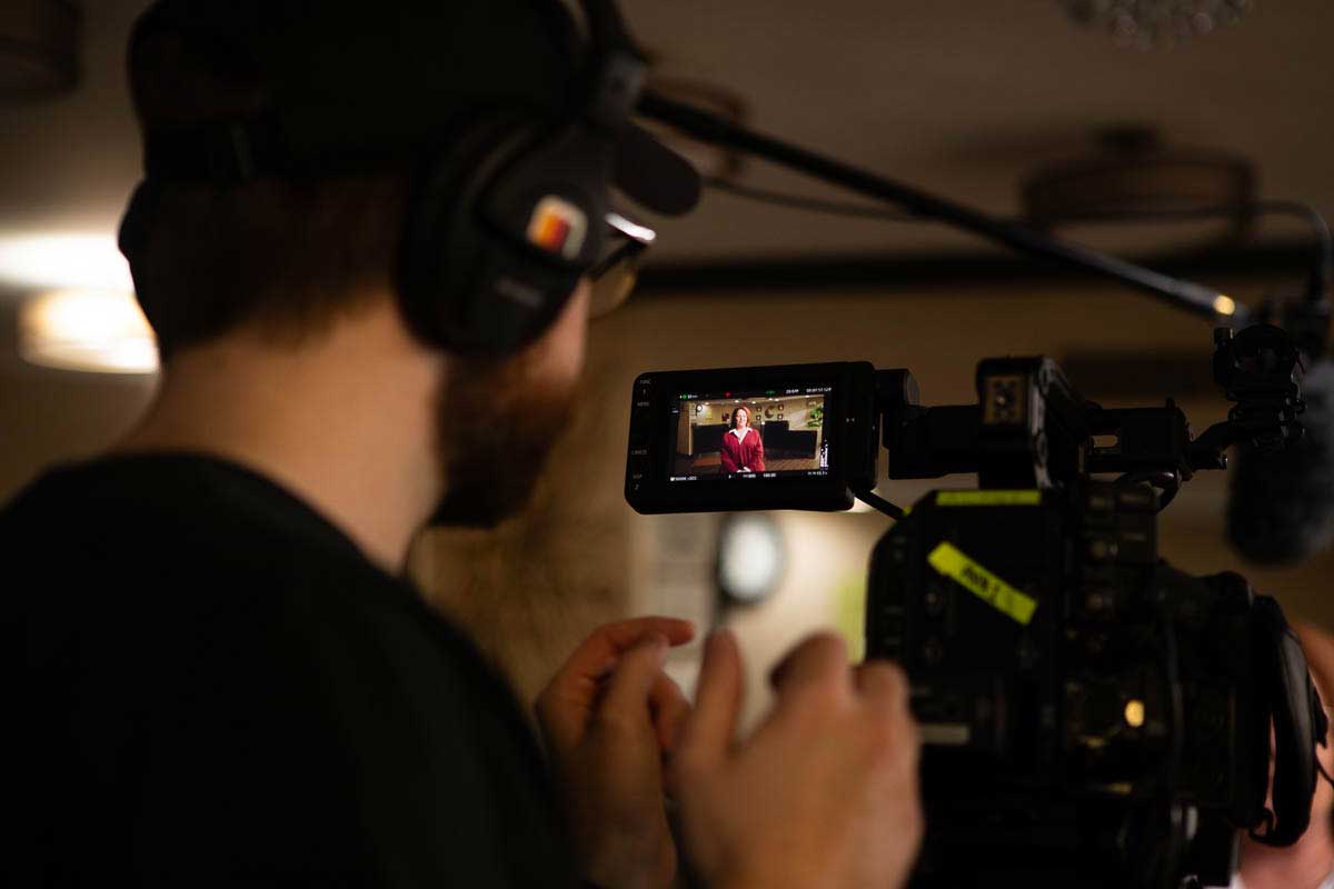 Behind-the-scenes of a commercial interview captured by Camos Media.