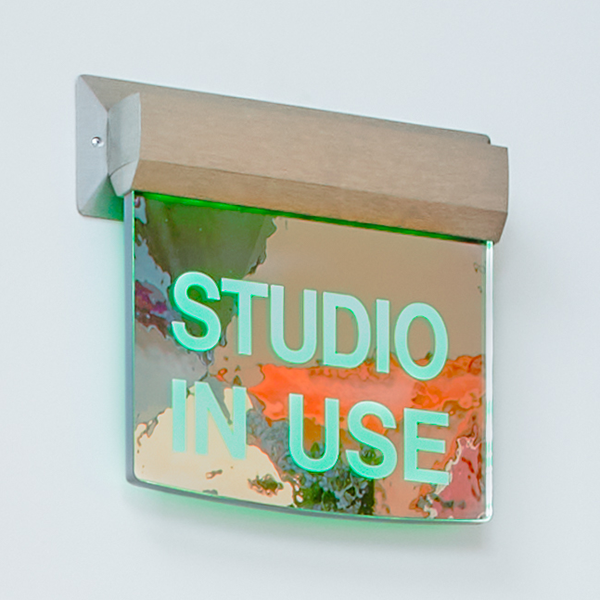 An image of the 'studio in use' sign.