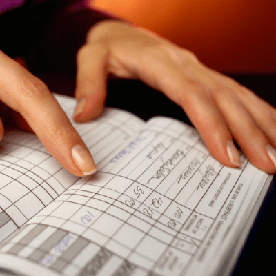 person balancing a checkbook