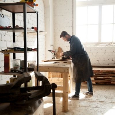 Person doing some sanding in their garage