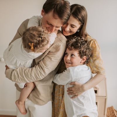 family hugging each other making sense of who you can claim as a dependent
