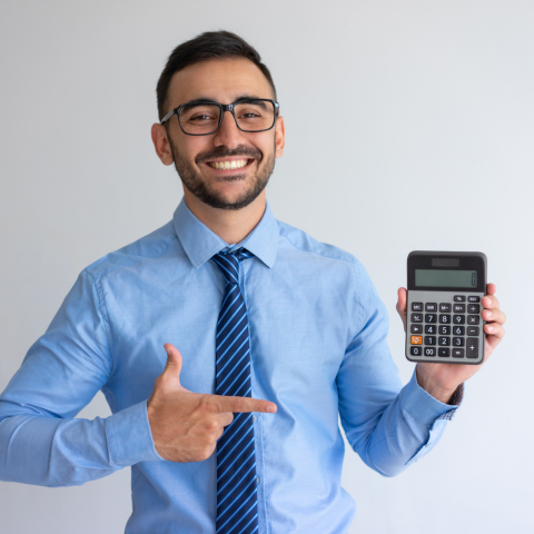 Person researching a small online loan on a smartphone and laptop