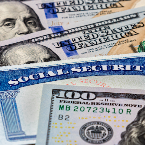 Senior couple reviewing financial paperwork with an advisor