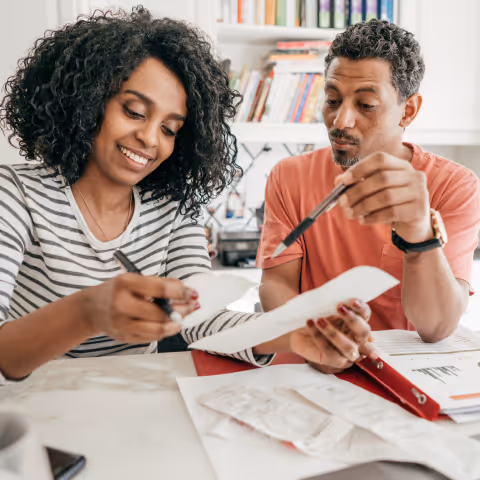 a couple sorting out documents together