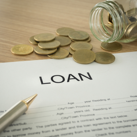 Banker explaining a loan agreement to a customer before signing