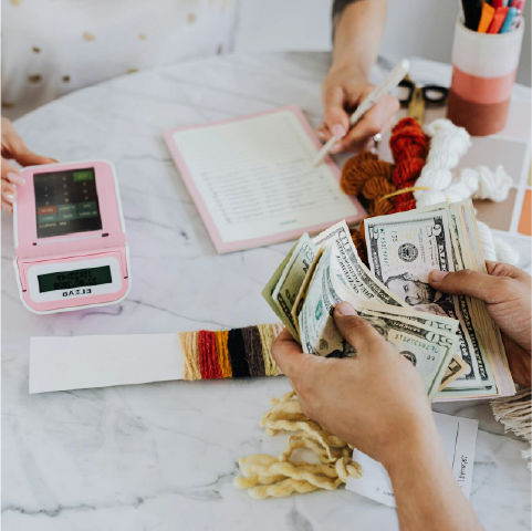calculating on a calculator with money