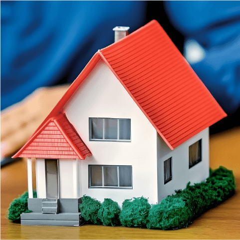 small house figurine on a desk