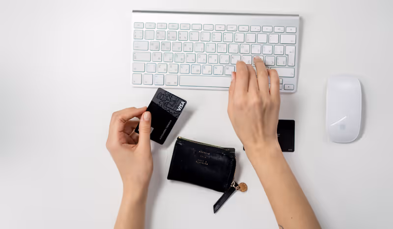 Person reviewing an electronic bank transfer on a laptop