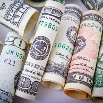 rolled dollar bills with adjusted gross income