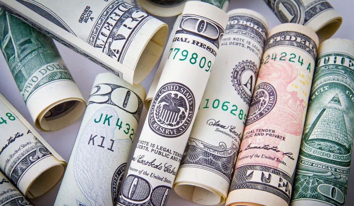 rolled dollar bills with adjusted gross income