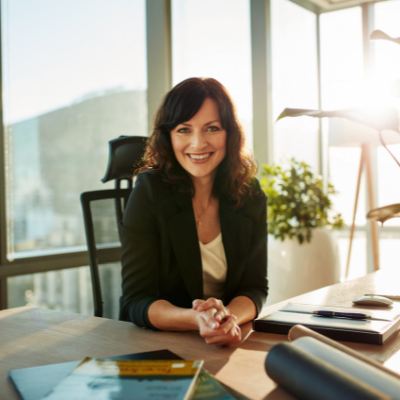 Attorney sitting at a desk in a sunlit office