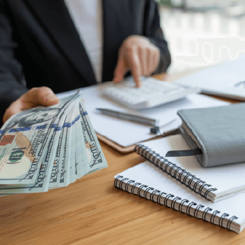 Customer signing paperwork at a financial service counter