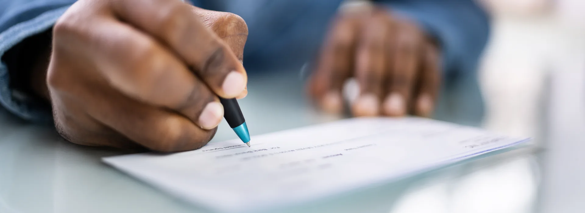 Payroll check and payment documents on a desk