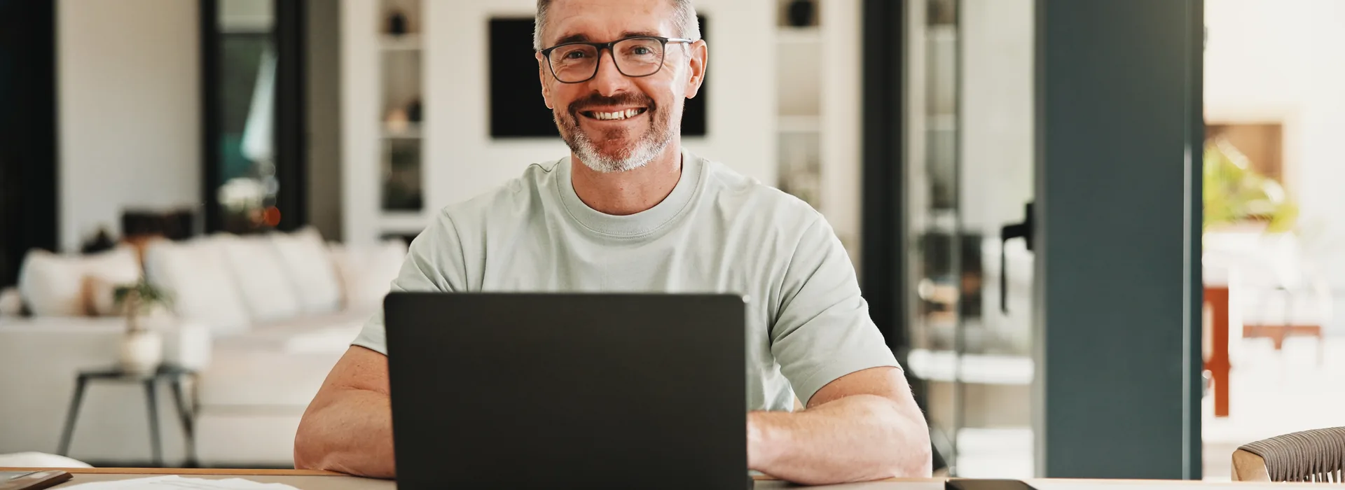 Man researching cash loan options on a laptop at home