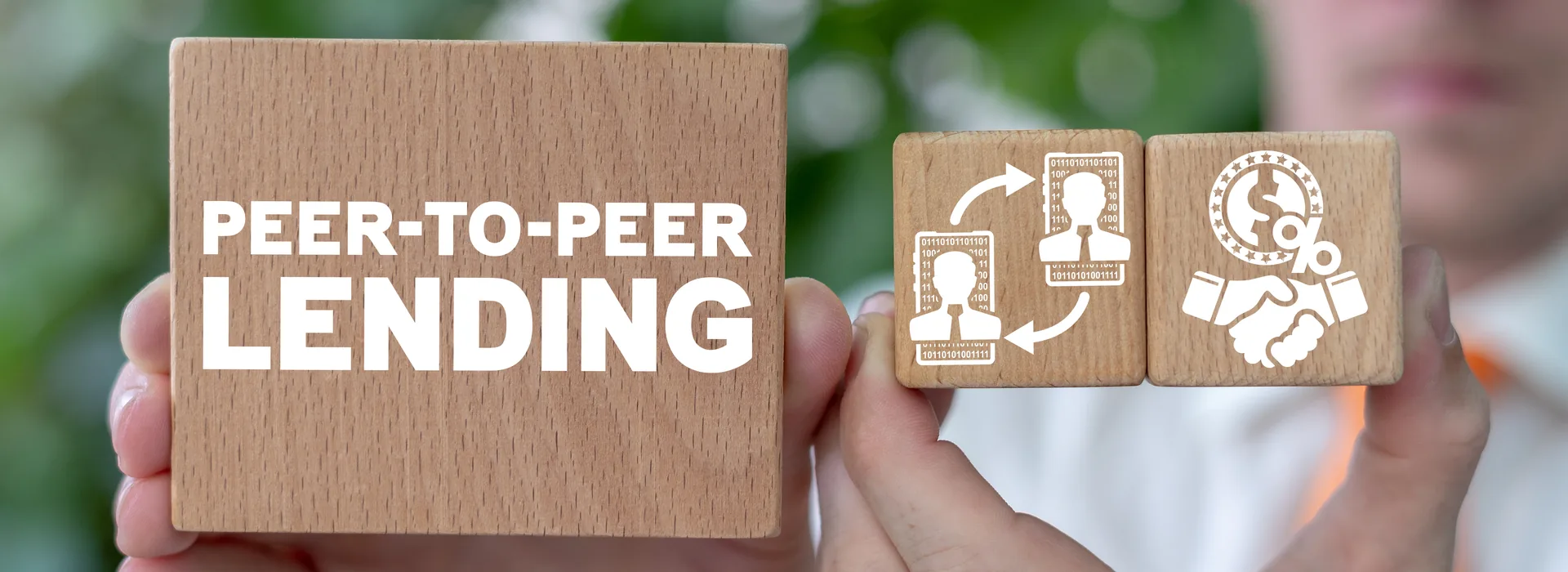 Peer-to-peer lending concept shown with connected wooden blocks