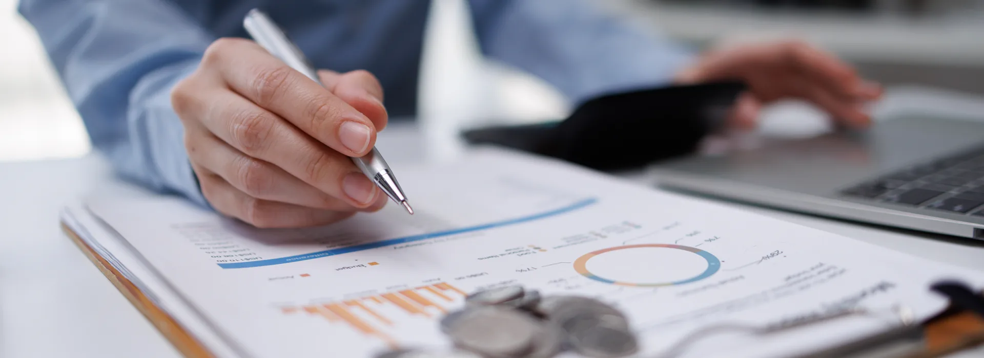 Person reviewing quick-loan paperwork beside a laptop