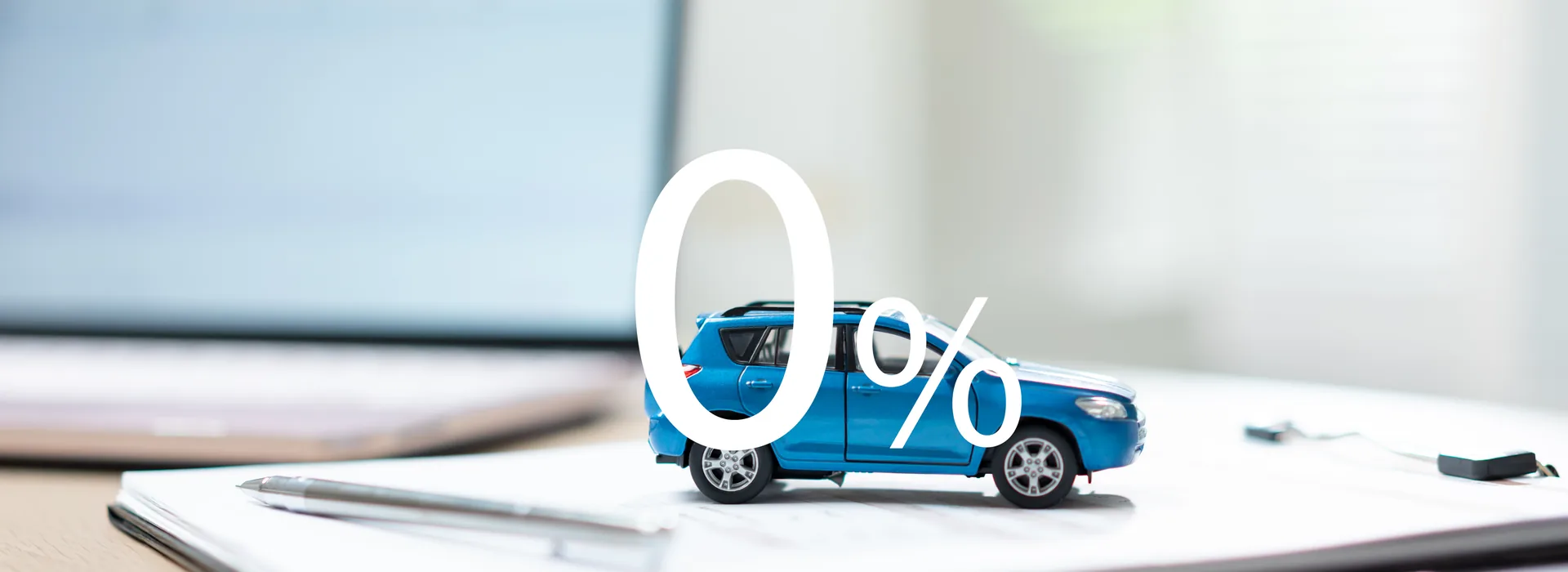 Zero-percent car financing offer beside loan application documents