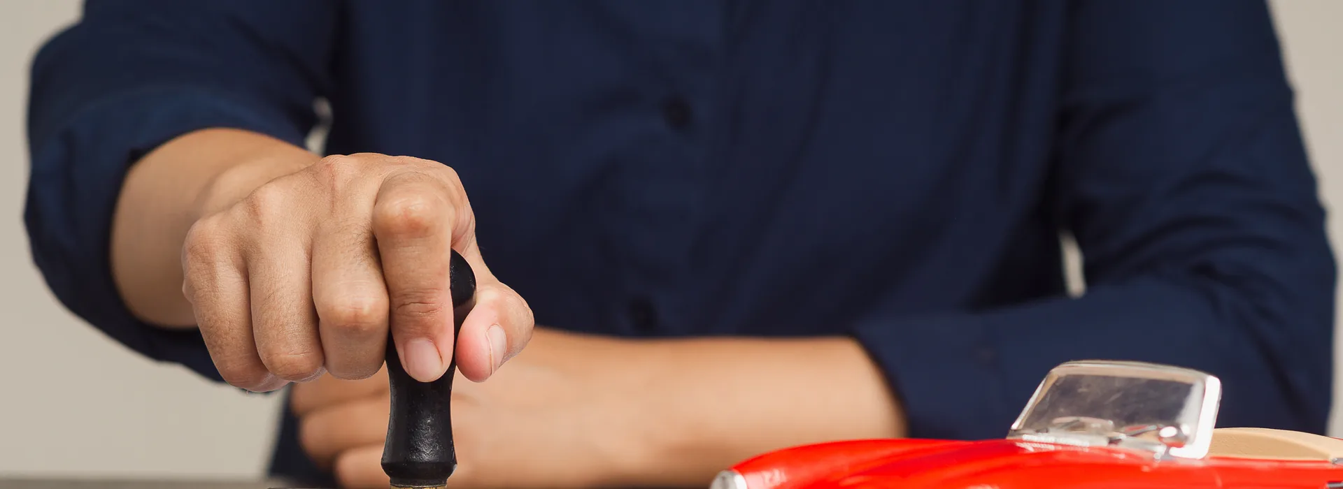 Car loan agreement being stamped approved