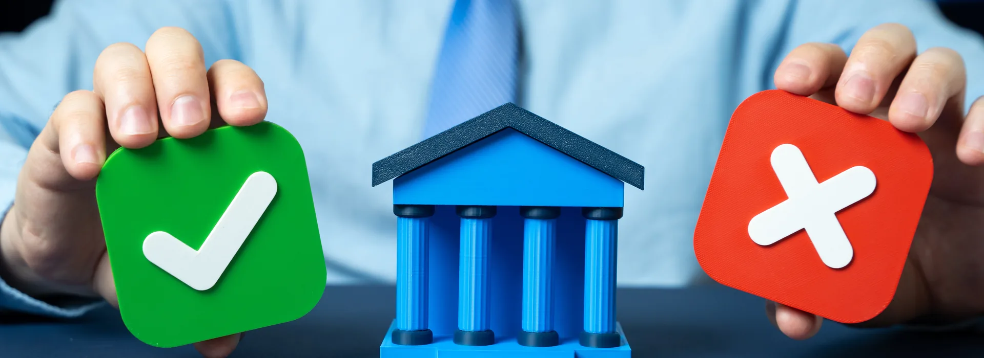 Loan approval and rejection choices shown beside a bank symbol