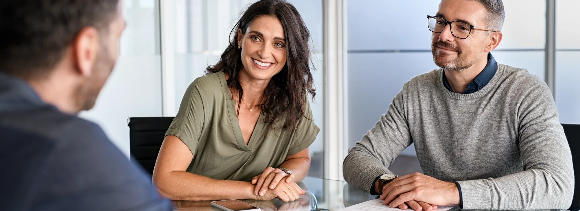 Couple meeting with a financial professional about a short-term loan