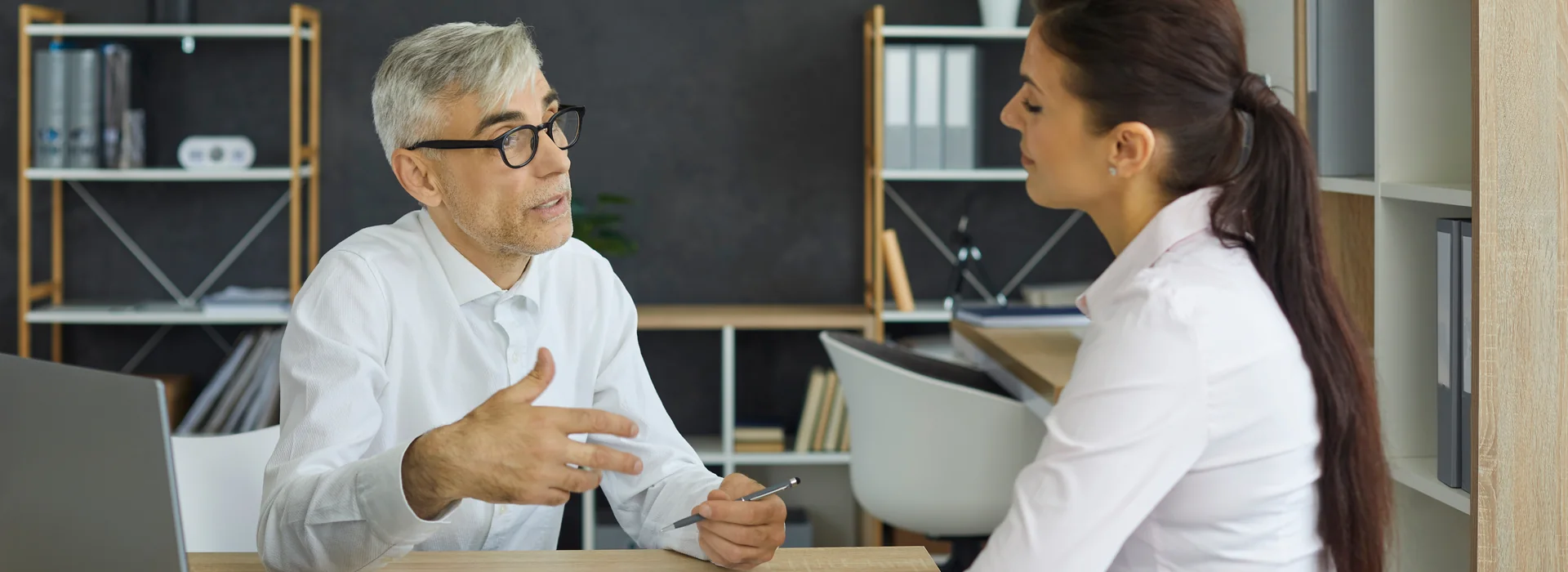 Customer reviewing financial paperwork with a bank employee