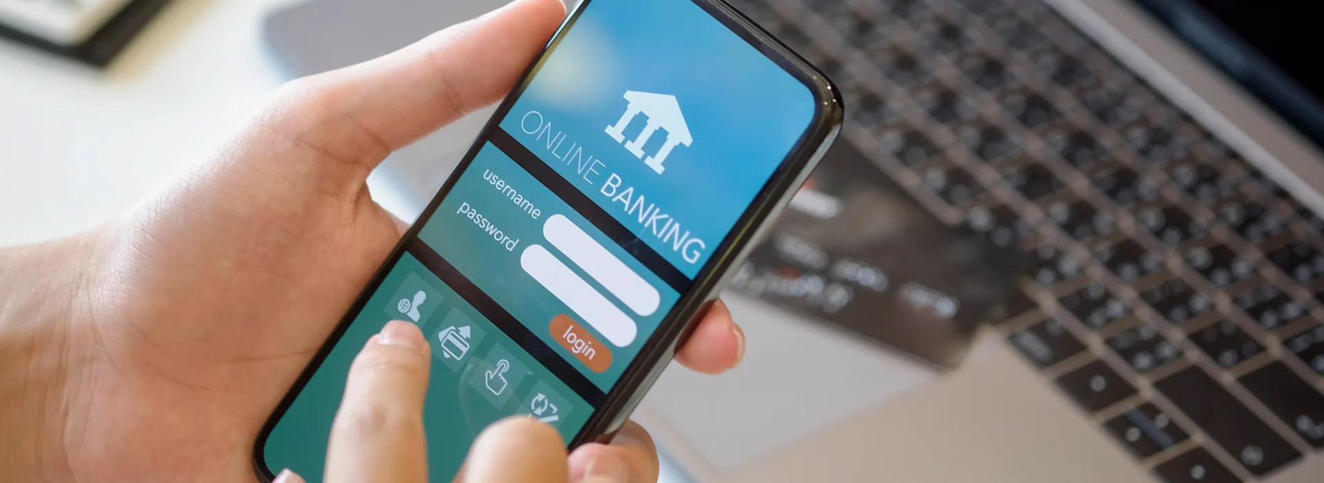 Person reviewing account activity in a mobile banking app