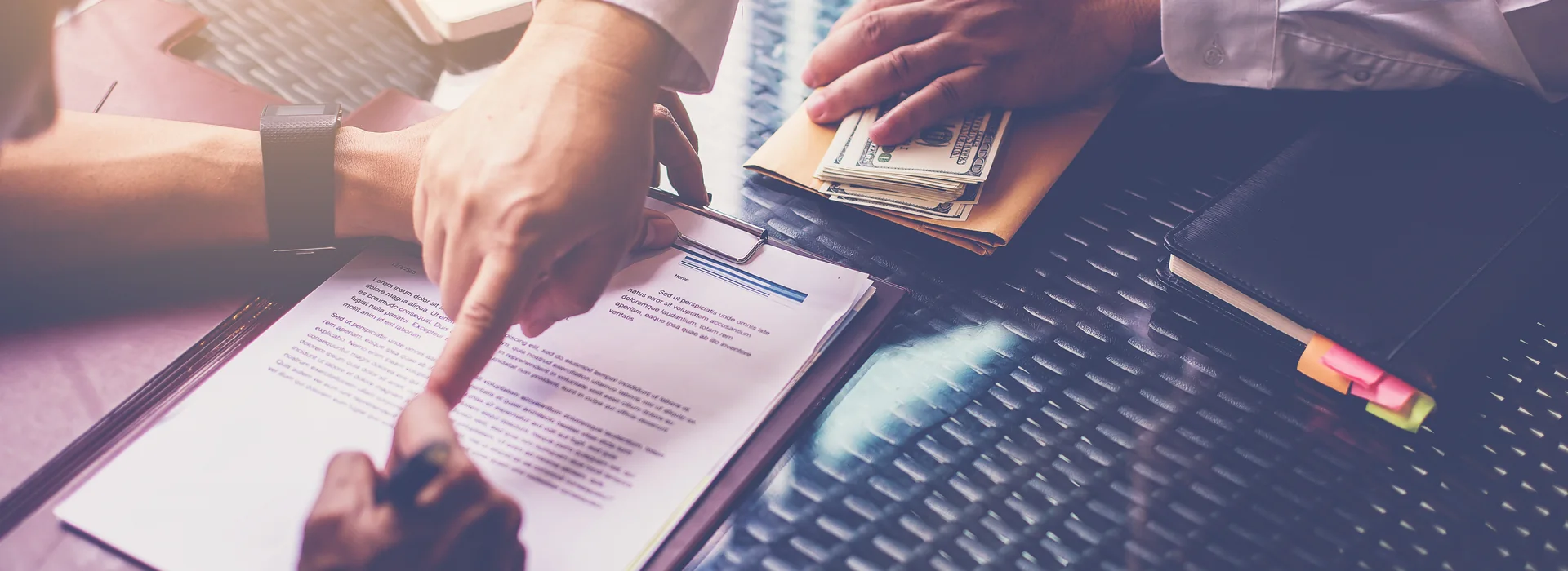 Banker explaining a loan agreement to a customer before signing