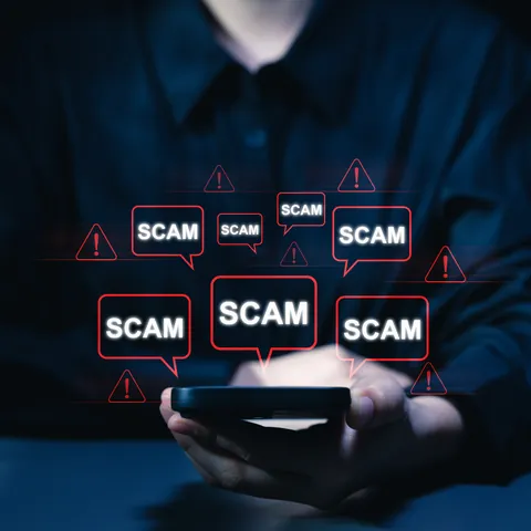 Online scam alert notification on smartphone screen