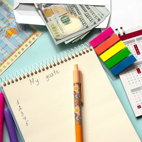 Travel goals and financial planning with notepad