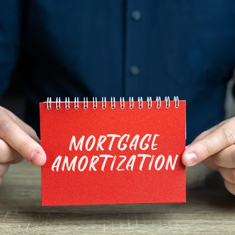Mortgage amortization plan reviewed with a loan payment schedule