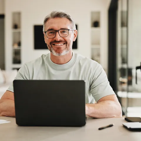 Man researching cash loan options on a laptop at home