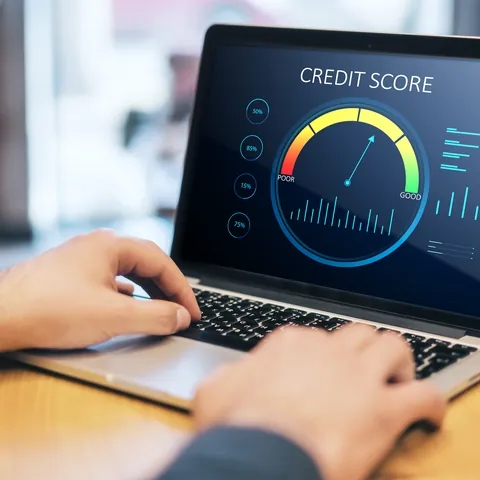 Credit score scale displayed on a laptop