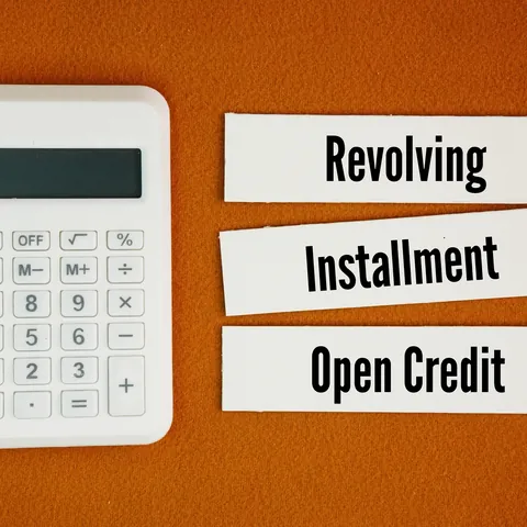 Revolving, installment, and open credit labels beside a calculator