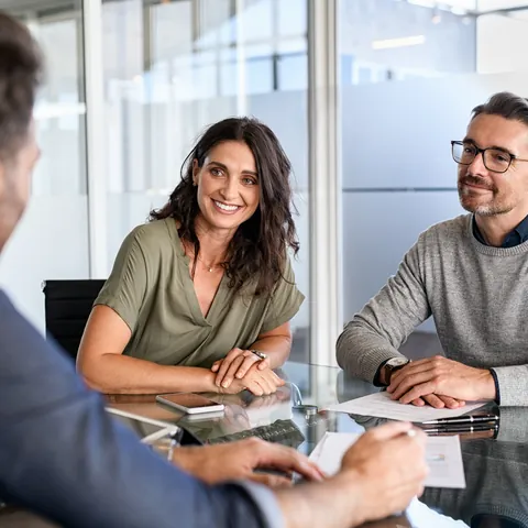 Couple meeting with a financial professional about a short-term loan