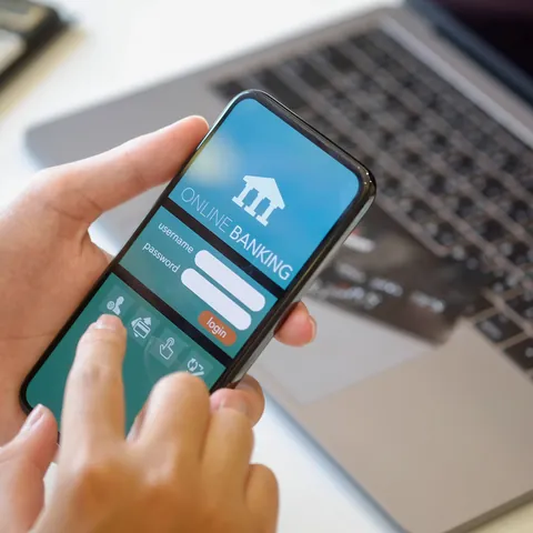 Person reviewing account activity in a mobile banking app
