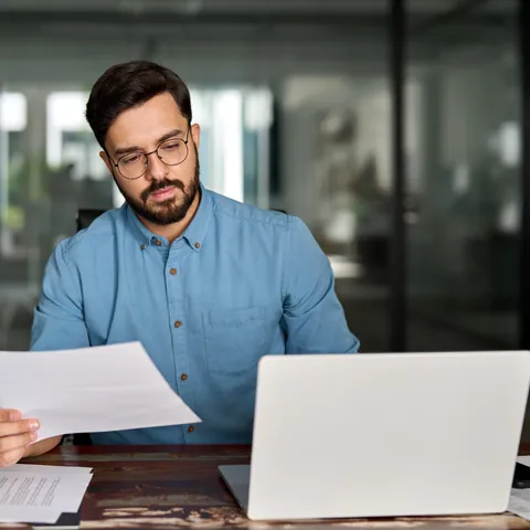 Person reviewing online loan documents on a laptop