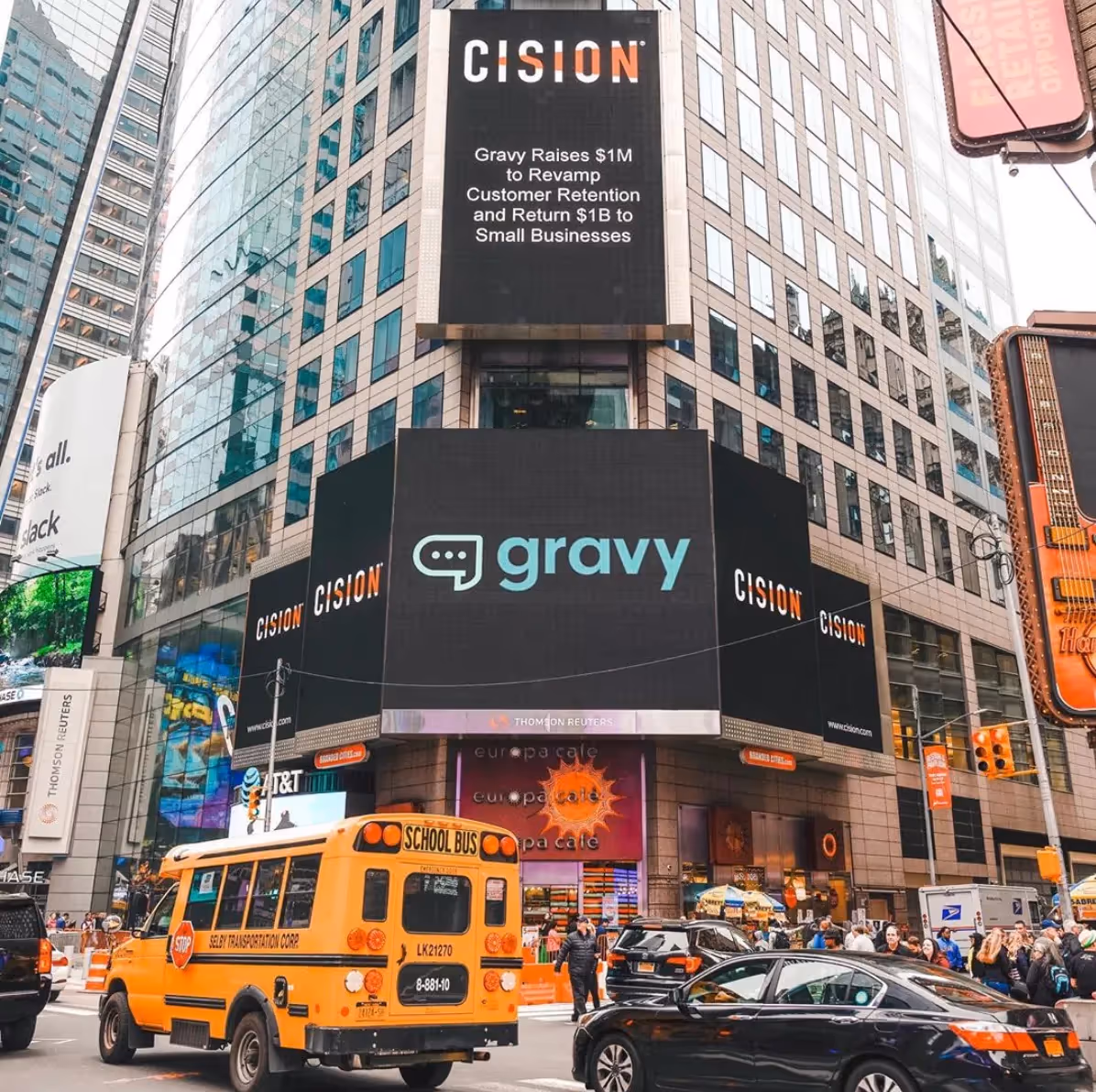 A NYC billboard displays the Gravy logo.
